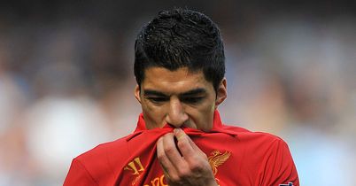 Luis Suarez finds the net from a spectacular free-kick as Liverpool draw with Manchester City at Anfield.